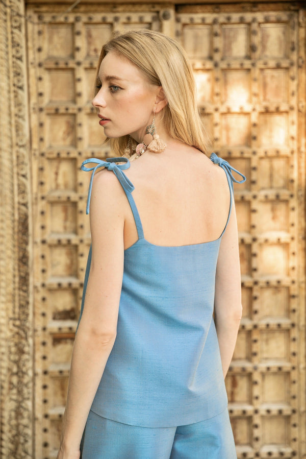 Image shows the back detailing for the handmade pure silk top of The Dawn Co Ord set in sky blue by Rare & Fair. 